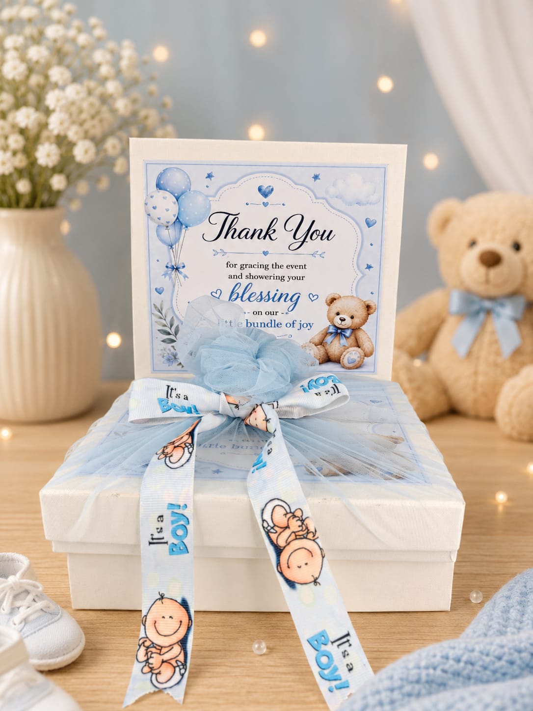 Baby boy thank you gift box wrapped with It's a Boy ribbon and teddy