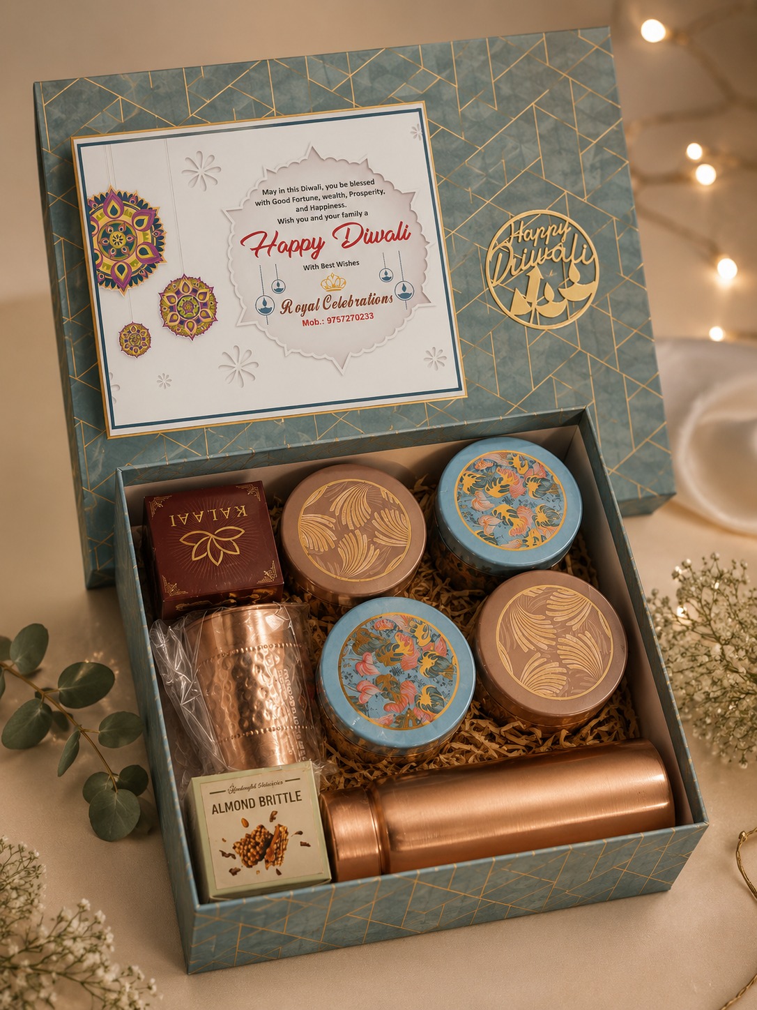 Blue geometric Happy Diwali premium hamper with copper bottle, tumbler and decorative tins