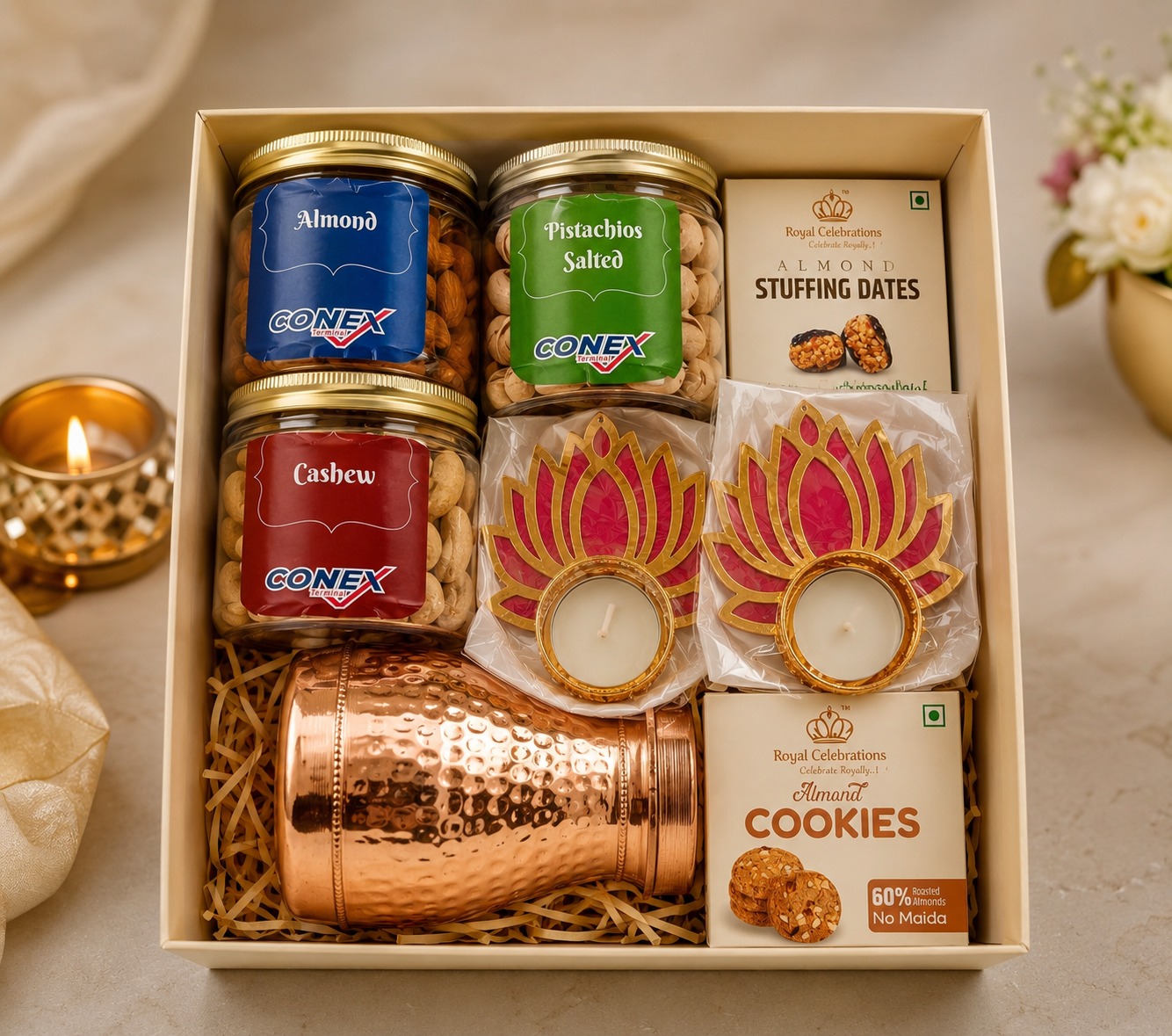 Festive dry fruit hamper with copper jars, lotus tealight diyas and copper bottle