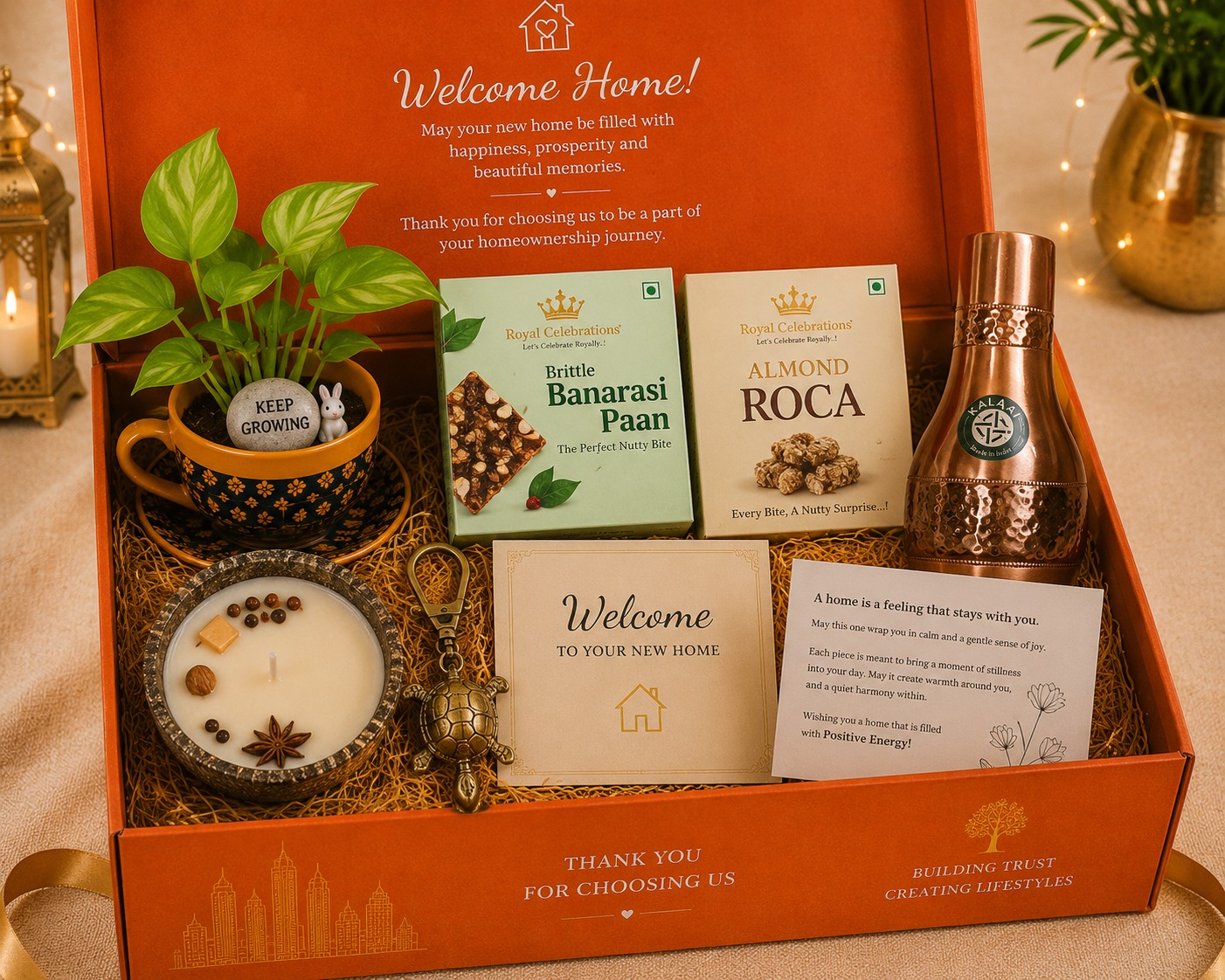 Orange Welcome Home housewarming box with copper bottle, plant and turtle keychain
