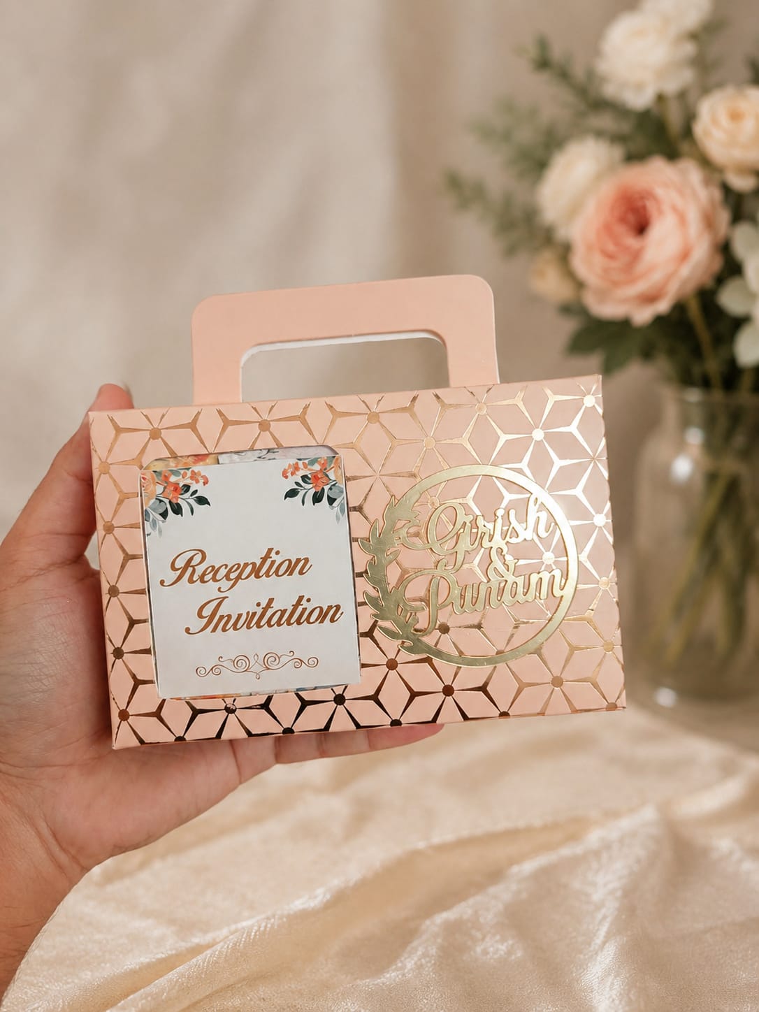 Rose gold reception invitation box with geometric foil pattern and personalised names